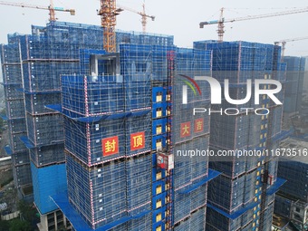 An aerial view shows a building under construction in Hangzhou, China, on October 17, 2024. (