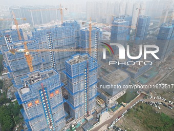 An aerial view shows a building under construction in Hangzhou, China, on October 17, 2024. (