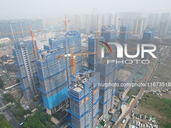 An aerial view shows a building under construction in Hangzhou, China, on October 17, 2024. (