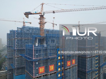 An aerial view shows a building under construction in Hangzhou, China, on October 17, 2024. (