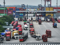 Trucks are seen at the Longtan Port area of Nanjing Port in Nanjing, Jiangsu province, China, on October 17, 2024. (