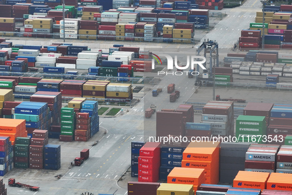 Trucks are seen at the Longtan Port area of Nanjing Port in Nanjing, Jiangsu province, China, on October 17, 2024. 