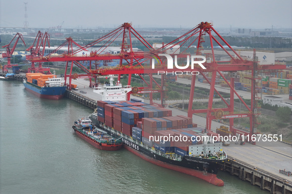 Cargo ships dock at the container terminal of Longtan Port Area of Nanjing Port in Nanjing, Jiangsu province, China, on October 17, 2024. 