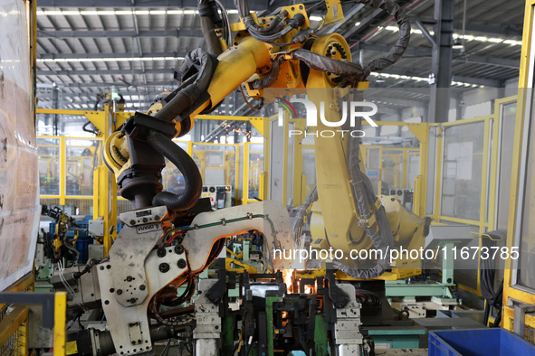 A worker makes auto parts at the production workshop of Zhenhua Zhende Auto Parts Co., Ltd. in Ningde, China, on October 17, 2024. 