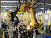 A worker makes auto parts at the production workshop of Zhenhua Zhende Auto Parts Co., Ltd. in Ningde, China, on October 17, 2024. (