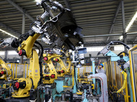 A worker makes auto parts at the production workshop of Zhenhua Zhende Auto Parts Co., Ltd. in Ningde, China, on October 17, 2024. (