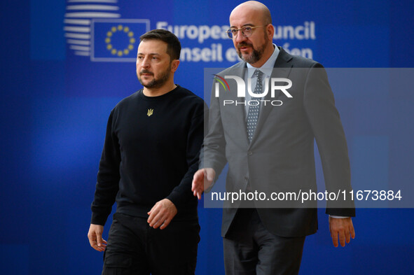 Ukraine's president Volodymyr Zelensky and European Council President Charles Michel arrive to attend the two-day European Council summit in...