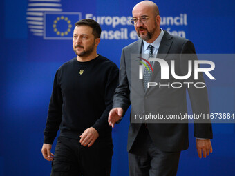 Ukraine's president Volodymyr Zelensky and European Council President Charles Michel arrive to attend the two-day European Council summit in...