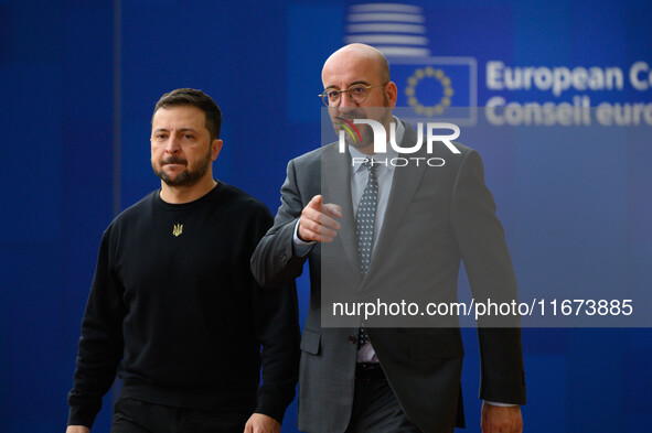 Ukraine's president Volodymyr Zelensky and European Council President Charles Michel arrive to attend the two-day European Council summit in...