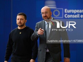 Ukraine's president Volodymyr Zelensky and European Council President Charles Michel arrive to attend the two-day European Council summit in...