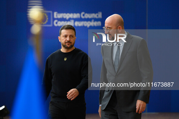 Ukraine's president Volodymyr Zelensky and European Council President Charles Michel arrive to attend the two-day European Council summit in...