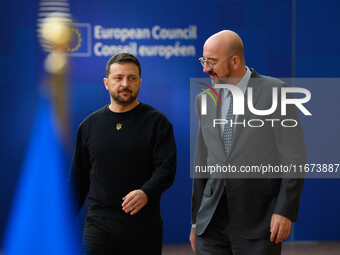 Ukraine's president Volodymyr Zelensky and European Council President Charles Michel arrive to attend the two-day European Council summit in...