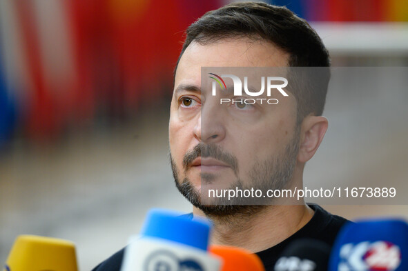 Ukraine's president Volodymyr Zelensky addresses the press as he arrives to attend the two-day European Council summit in Brussels, Belgium,...