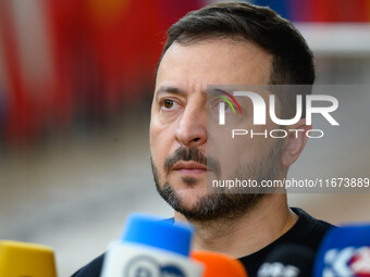 Ukraine's president Volodymyr Zelensky addresses the press as he arrives to attend the two-day European Council summit in Brussels, Belgium,...