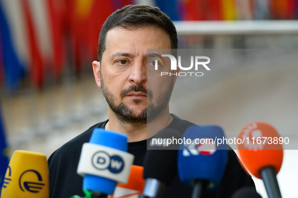 Ukraine's president Volodymyr Zelensky addresses the press as he arrives to attend the two-day European Council summit in Brussels, Belgium,...