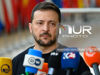 Ukraine's president Volodymyr Zelensky addresses the press as he arrives to attend the two-day European Council summit in Brussels, Belgium,...