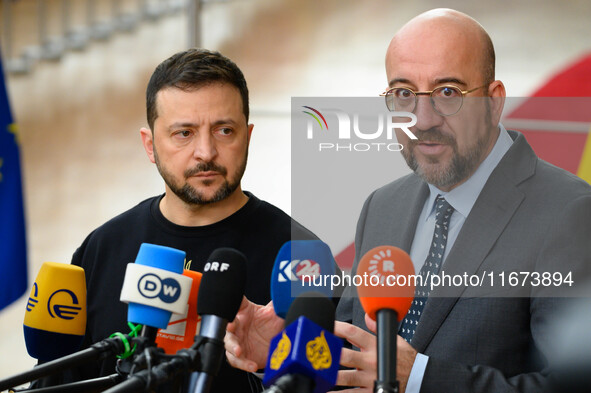 Ukraine's president Volodymyr Zelensky and European Council President Charles Michel address the press as they arrive to attend the two-day...