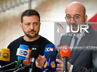 Ukraine's president Volodymyr Zelensky and European Council President Charles Michel address the press as they arrive to attend the two-day...