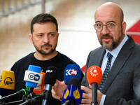 Ukraine's president Volodymyr Zelensky and European Council President Charles Michel address the press as they arrive to attend the two-day...