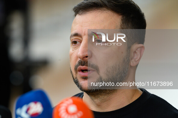 Ukraine's president Volodymyr Zelensky addresses the press as he arrives to attend the two-day European Council summit in Brussels, Belgium,...