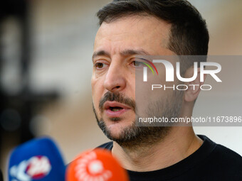 Ukraine's president Volodymyr Zelensky addresses the press as he arrives to attend the two-day European Council summit in Brussels, Belgium,...