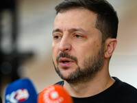 Ukraine's president Volodymyr Zelensky addresses the press as he arrives to attend the two-day European Council summit in Brussels, Belgium,...