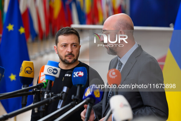 Ukraine's president Volodymyr Zelensky and European Council President Charles Michel address the press as they arrive to attend the two-day...