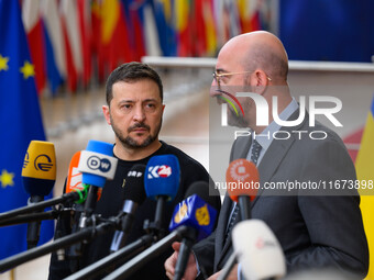 Ukraine's president Volodymyr Zelensky and European Council President Charles Michel address the press as they arrive to attend the two-day...