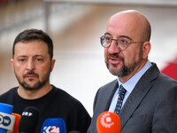 Ukraine's president Volodymyr Zelensky and European Council President Charles Michel address the press as they arrive to attend the two-day...