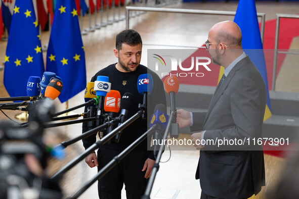 Ukraine's president Volodymyr Zelensky and European Council President Charles Michel address the press as they arrive to attend the two-day...