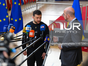 Ukraine's president Volodymyr Zelensky and European Council President Charles Michel address the press as they arrive to attend the two-day...