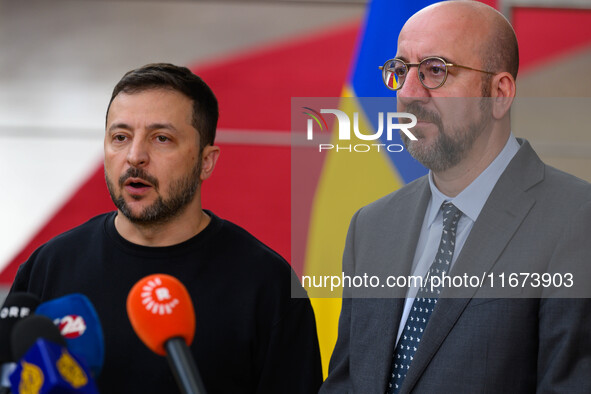 Ukraine's president Volodymyr Zelensky and European Council President Charles Michel address the press as they arrive to attend the two-day...