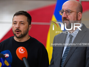 Ukraine's president Volodymyr Zelensky and European Council President Charles Michel address the press as they arrive to attend the two-day...