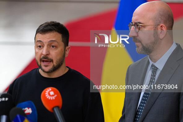 Ukraine's president Volodymyr Zelensky and European Council President Charles Michel address the press as they arrive to attend the two-day...