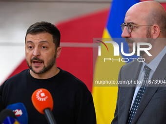 Ukraine's president Volodymyr Zelensky and European Council President Charles Michel address the press as they arrive to attend the two-day...