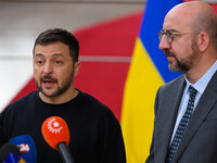 Ukraine's president Volodymyr Zelensky and European Council President Charles Michel address the press as they arrive to attend the two-day...