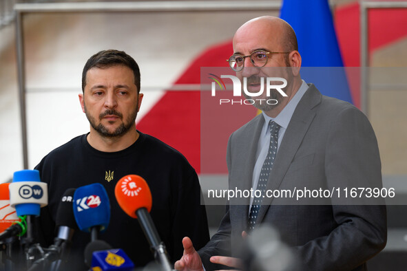 Ukraine's president Volodymyr Zelensky and European Council President Charles Michel address the press as they arrive to attend the two-day...