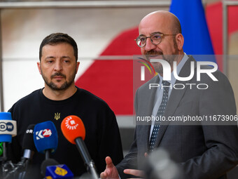 Ukraine's president Volodymyr Zelensky and European Council President Charles Michel address the press as they arrive to attend the two-day...