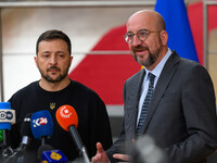 Ukraine's president Volodymyr Zelensky and European Council President Charles Michel address the press as they arrive to attend the two-day...