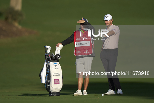 Rasmus Hojgaard of Denmark talks with his caddie on the 10th hole on day one of the Estrella Damm N.A. Andalucia Masters 2024 at Real Club d...