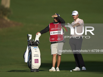 Rasmus Hojgaard of Denmark talks with his caddie on the 10th hole on day one of the Estrella Damm N.A. Andalucia Masters 2024 at Real Club d...