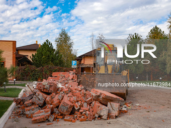 A tractor removes the rubble near the Delta hotel and restaurant damaged by a Russian drone attack in Vylkove, Ukraine, on October 11, 2024....