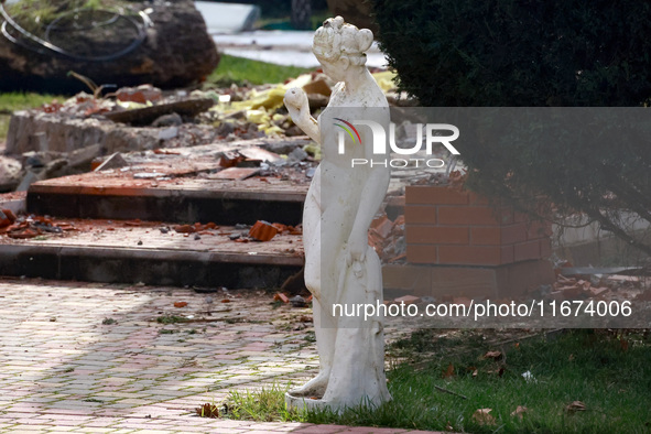 A statue stands near the Delta hotel and restaurant, which is damaged by a Russian drone attack in Vylkove, Ukraine, on October 11, 2024. 