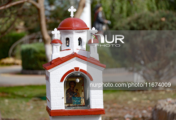 A scale model of a church is near the Delta hotel and restaurant damaged by a Russian drone attack in Vylkove, Ukraine, on October 11, 2024....