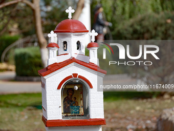 A scale model of a church is near the Delta hotel and restaurant damaged by a Russian drone attack in Vylkove, Ukraine, on October 11, 2024....