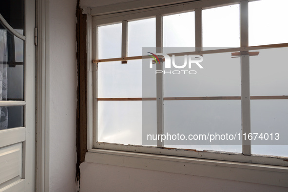 A piece of film seals off a window in a damaged house in Vylkove, Odesa region, southern Ukraine, which is under constant Russian drone atta...