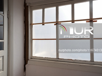 A piece of film seals off a window in a damaged house in Vylkove, Odesa region, southern Ukraine, which is under constant Russian drone atta...