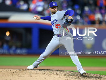 Los Angeles Dodgers relief pitcher Blake Treinen #49 throws during the eighth inning in Game 3 of the baseball NL Championship Series agains...