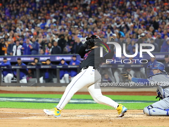 New York Mets' Francisco Alvarez #4 loses his bat during the second inning in Game 3 of the baseball NL Championship Series against the Los...