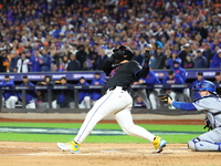 New York Mets' Francisco Alvarez #4 loses his bat during the second inning in Game 3 of the baseball NL Championship Series against the Los...